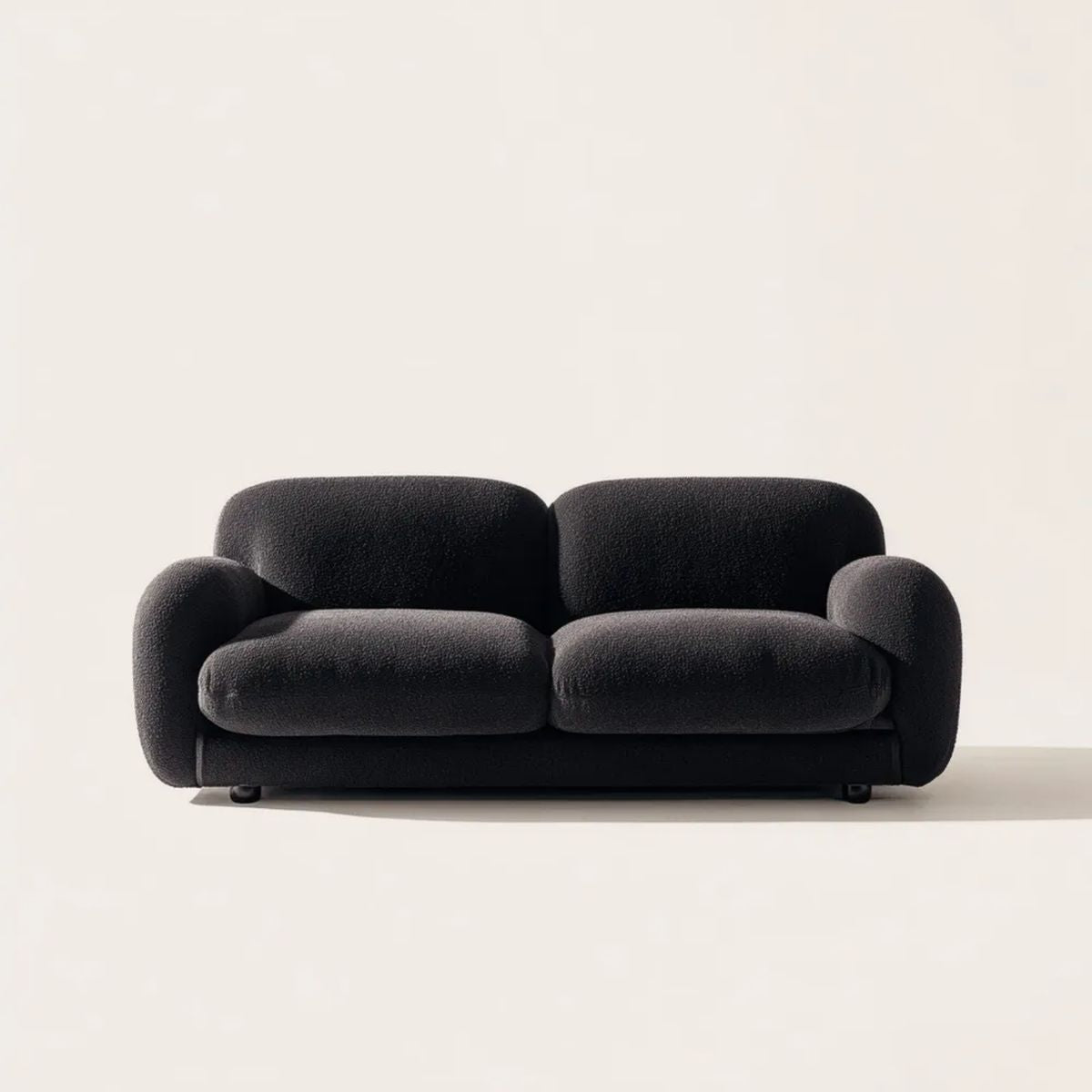Czarna sofa dwuosobowa z tapicerką bouclé 180 × 90 × 78 cm